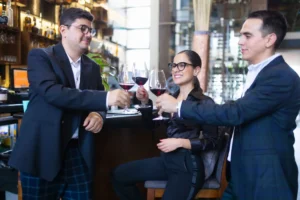 People toasting with wine glasses